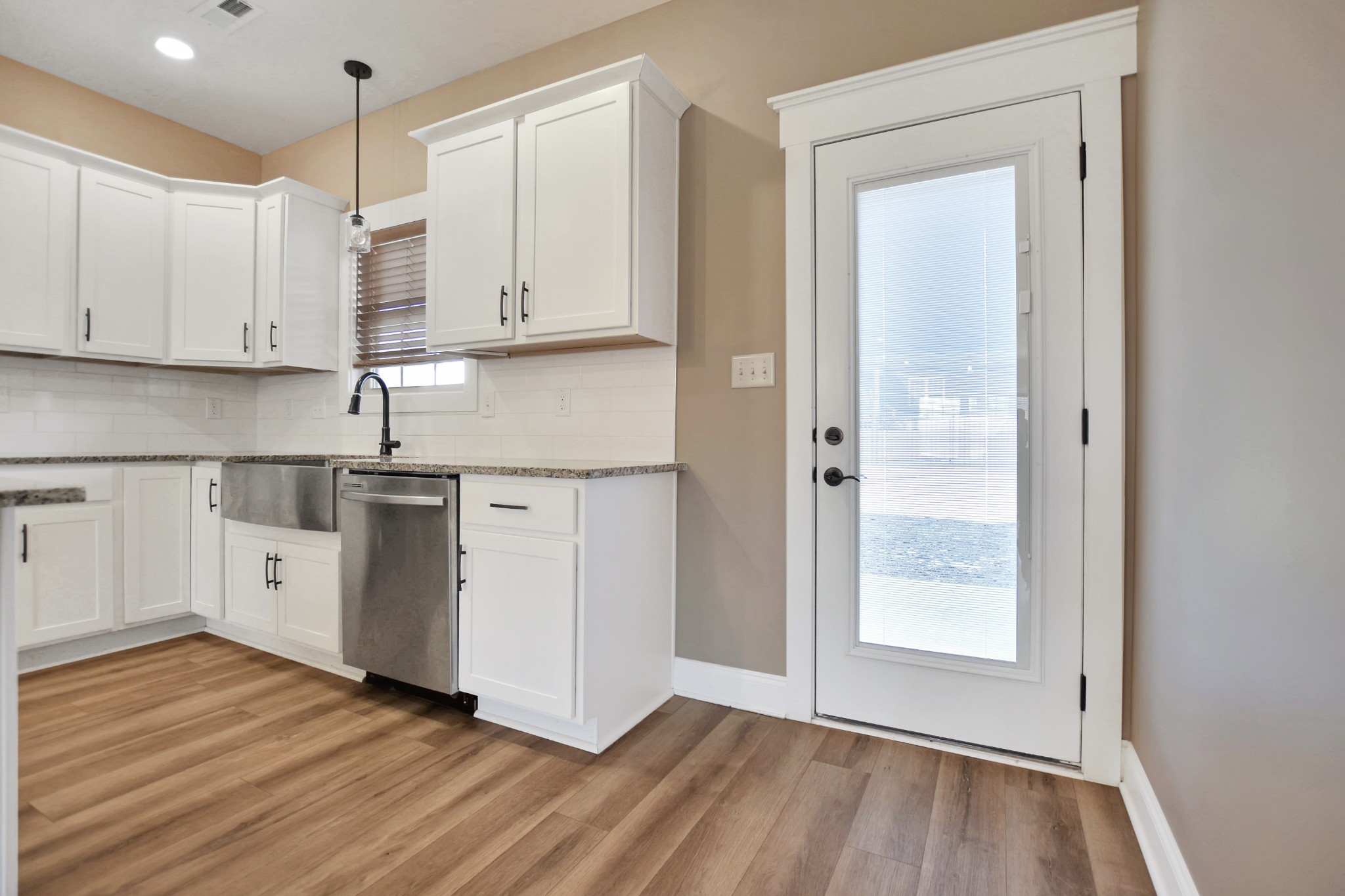 3495 Rabbit Run Trail Clarksville, TN 37043 - Photo 15 of 27 a view of a kitchen with wooden floor and electronic appliances