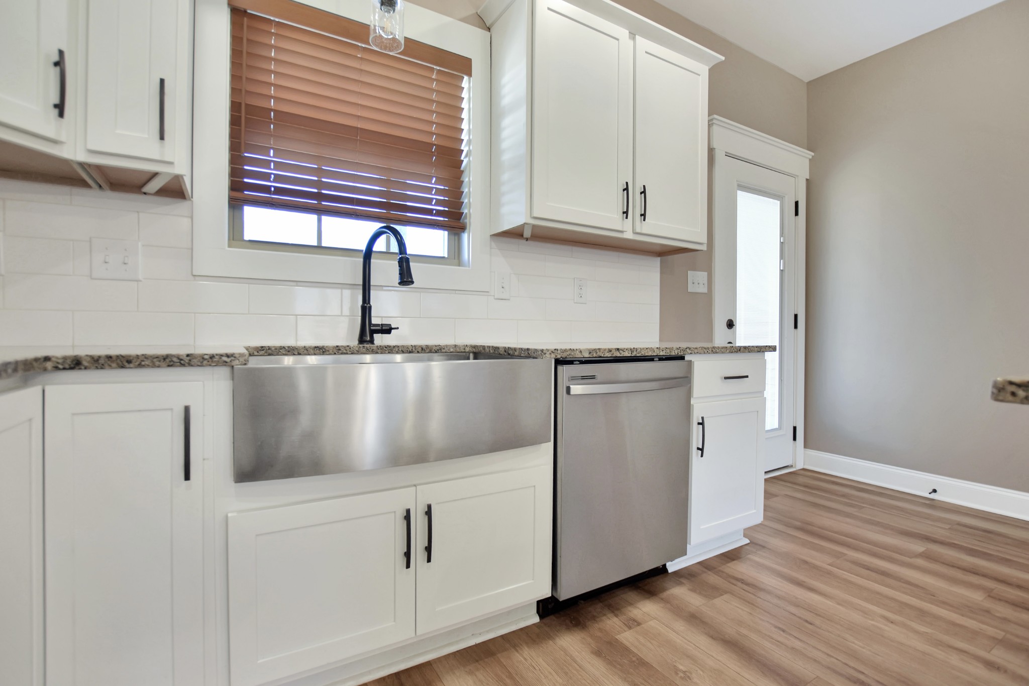 3495 Rabbit Run Trail Clarksville, TN 37043 - Photo 16 of 27 a kitchen with granite countertop white cabinets and white appliances