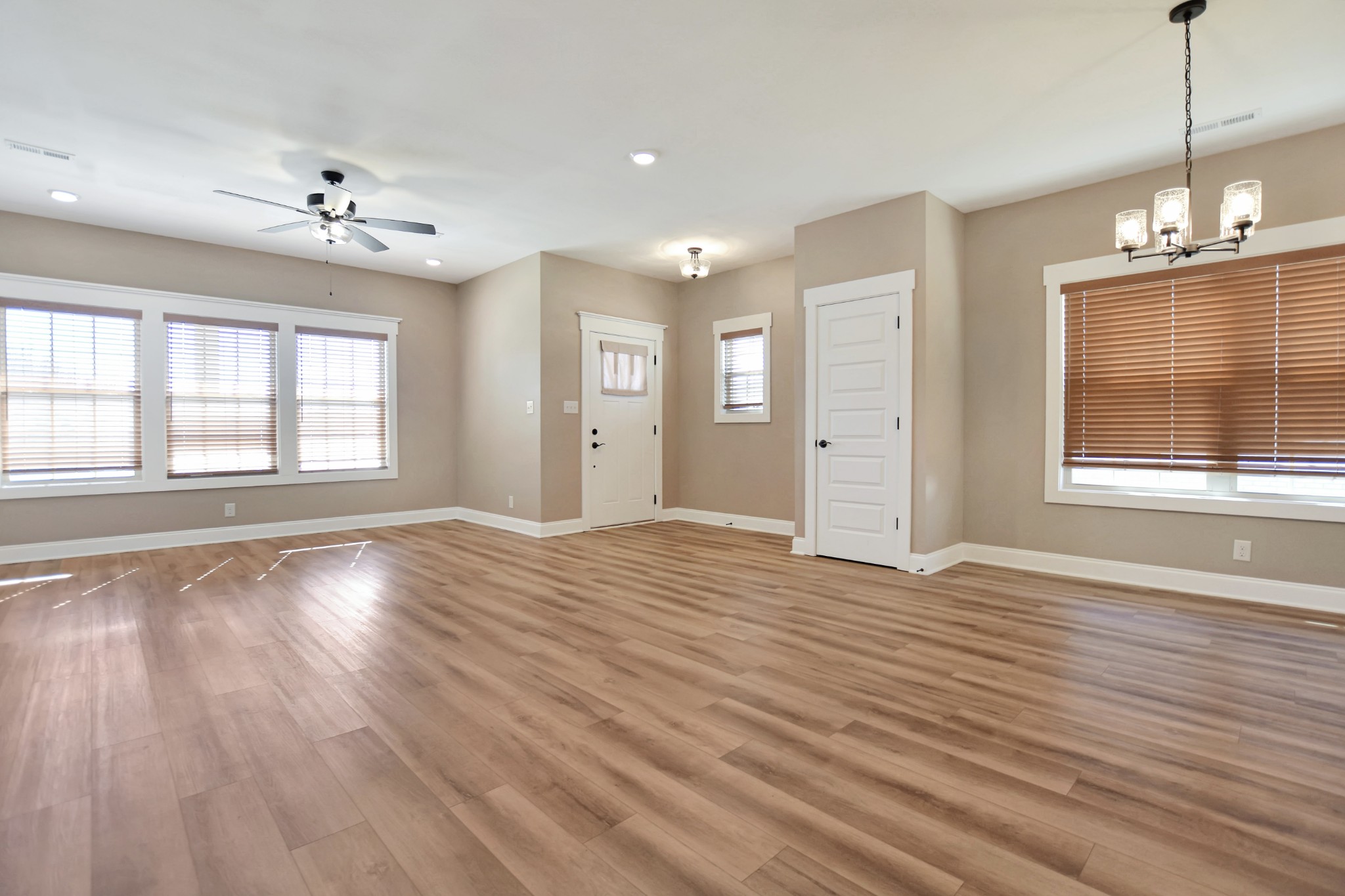 3495 Rabbit Run Trail Clarksville, TN 37043 - Photo 4 of 27 a view of an empty room with wooden floor and a window