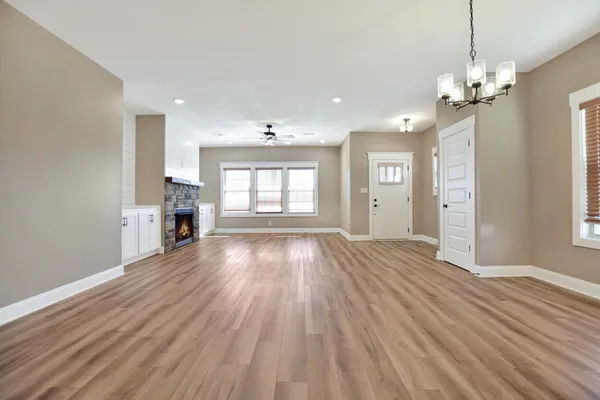 a view of livingroom with kitchen and hardwood floor