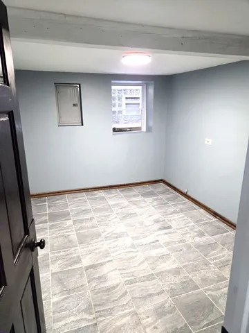 a view of empty room with windows