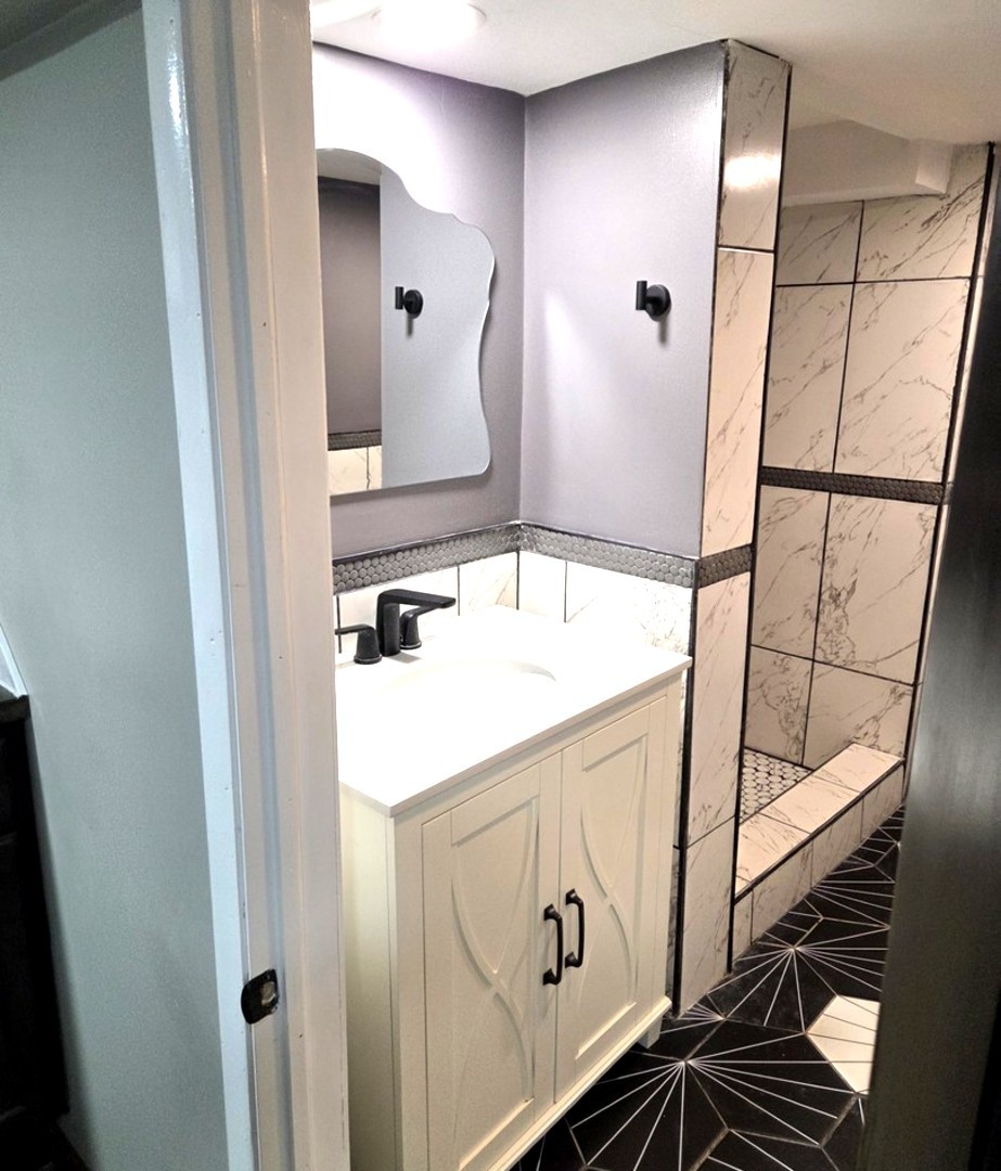 6324 South Francisco Avenue Chicago, IL 60629 - Photo 21 of 25 a bathroom with a sink and mirror