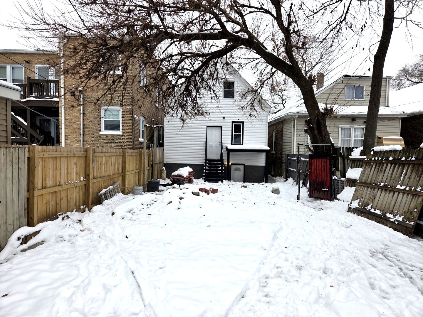 6324 South Francisco Avenue Chicago, IL 60629 - Photo 3 of 25 a view of a backyard of snow