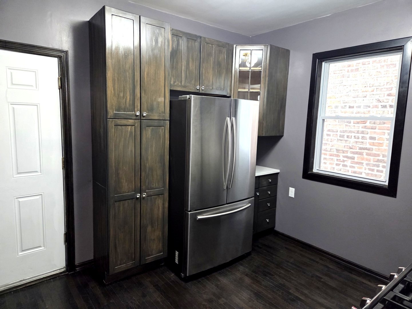 6324 South Francisco Avenue Chicago, IL 60629 - Photo 6 of 25 a view of an empty room with wooden floor and a window