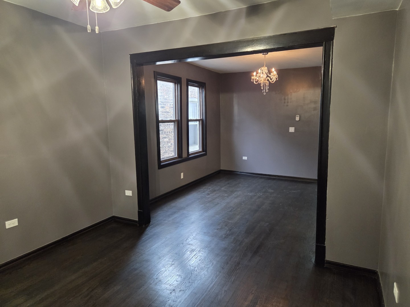 6324 South Francisco Avenue Chicago, IL 60629 - Photo 8 of 25 an empty room with wooden floor and windows