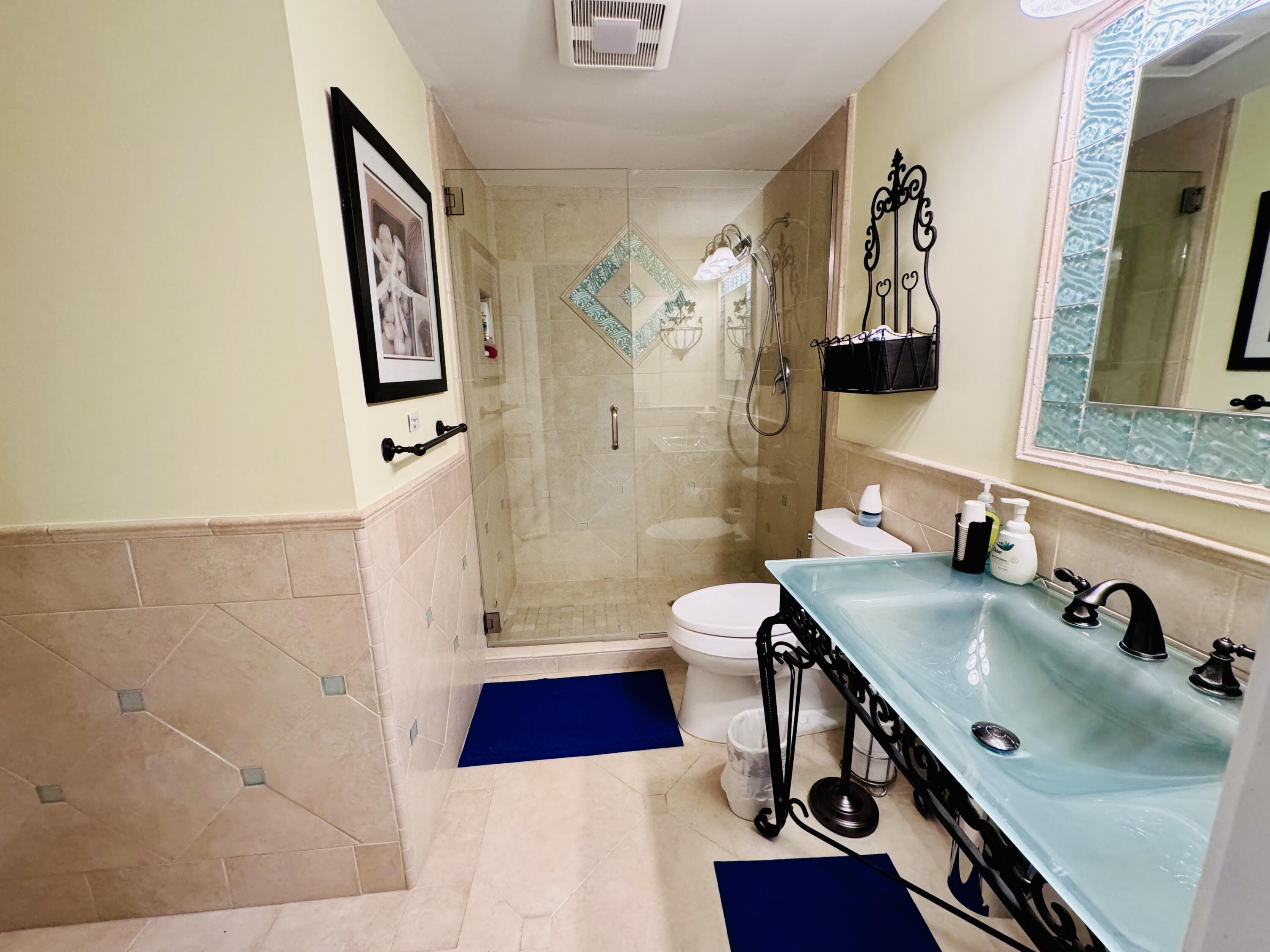 200 South Beach Road, Unit 403 Tequesta, FL 33469 - Photo 14 of 46 a bathroom with a sink and a mirror