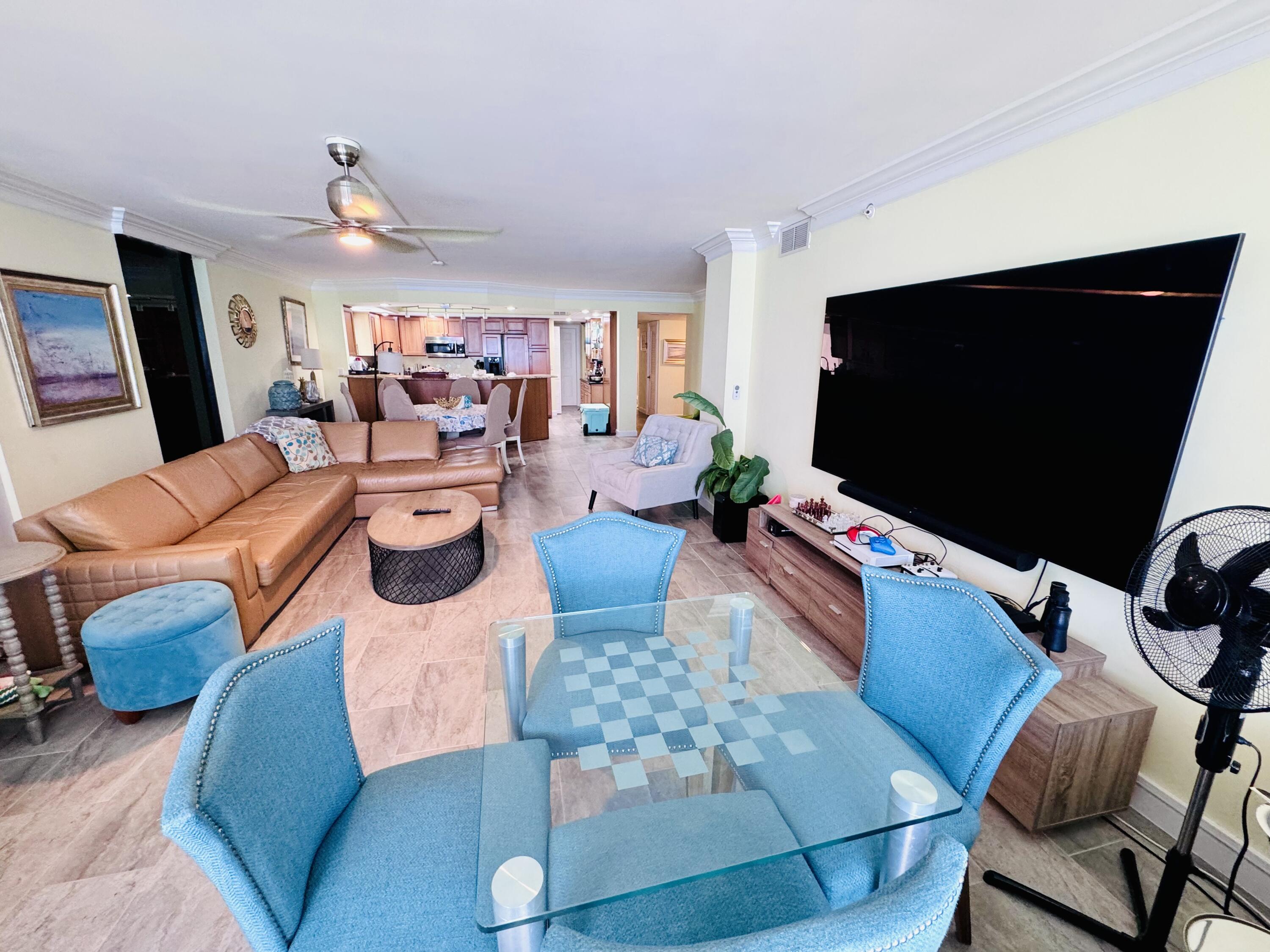 200 South Beach Road, Unit 403 Tequesta, FL 33469 - Photo 30 of 46 a living room with furniture and a flat screen tv