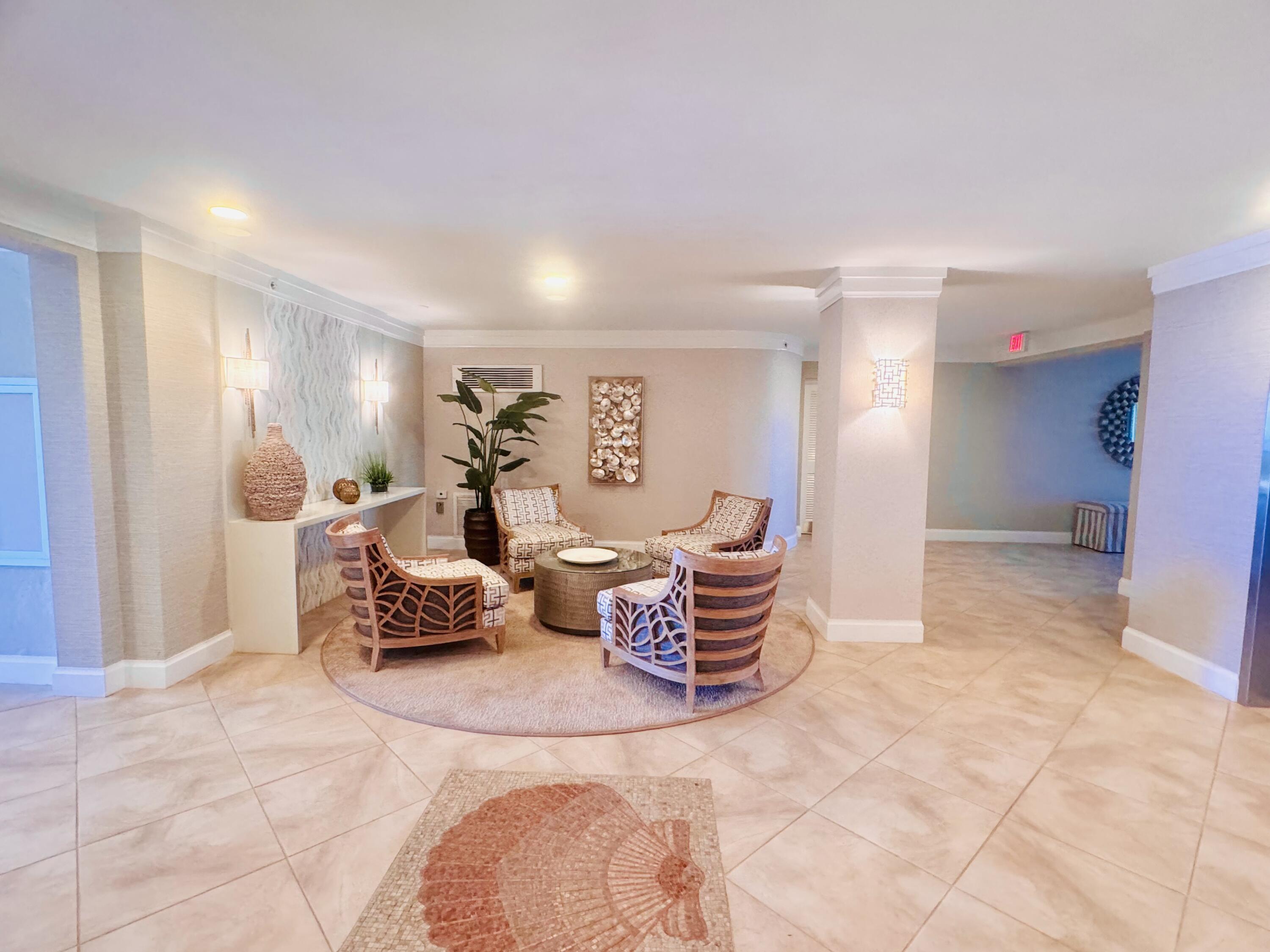 200 South Beach Road, Unit 403 Tequesta, FL 33469 - Photo 3 of 46 a living room with furniture and a large window