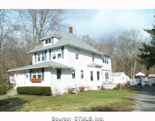 214 Middle Road Preston, CT 06365 - Photo 1 of 1 a view of a white house next to a yard with big trees