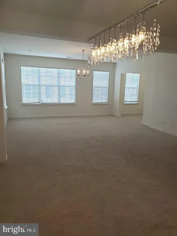 a view of a windows and chandelier in a room