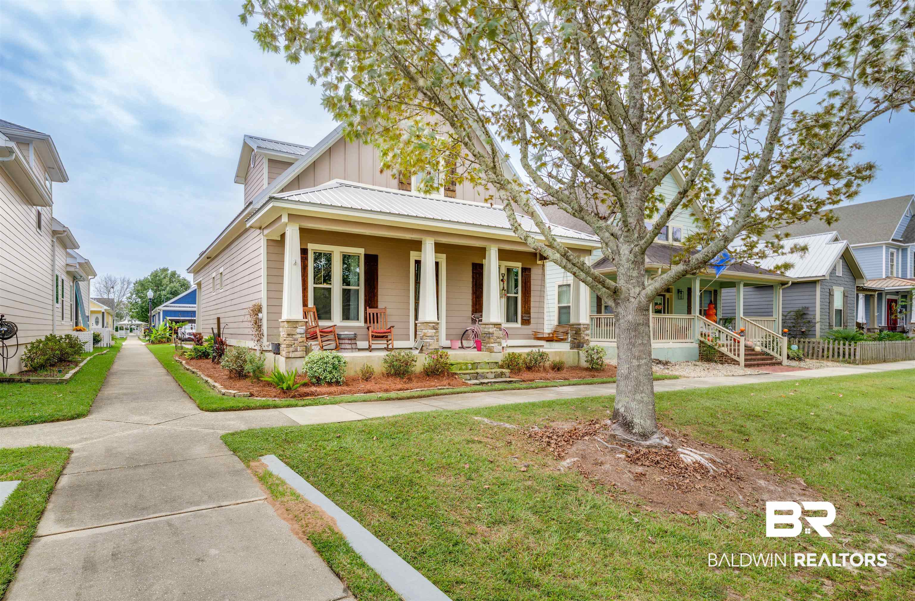 1119 Pink Poppy Lane Foley, AL 36535 - Photo 1 of 38 Doorway to property with covered porch and a metal roof