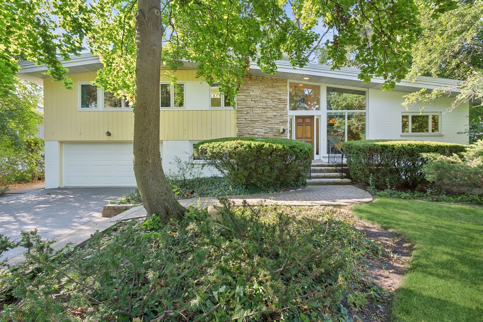 front view of a house with a yard