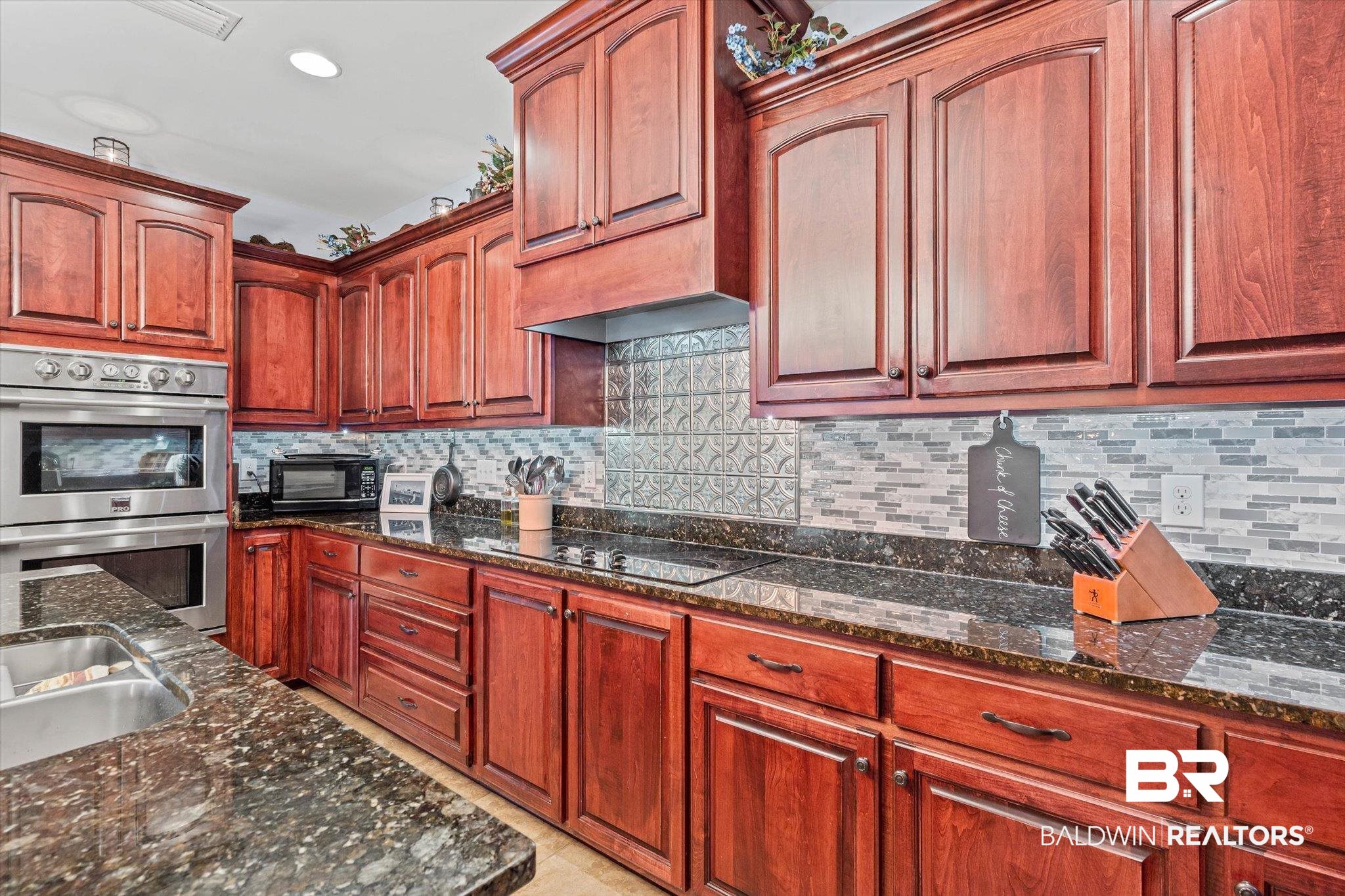 6175 South Grand Bay Wilmer Road Grand Bay, AL 36541 - Photo 8 of 42 Kitchen featuring dark stone countertops, tasteful backsplash, stainless steel double oven, recessed lighting, and black electric stovetop