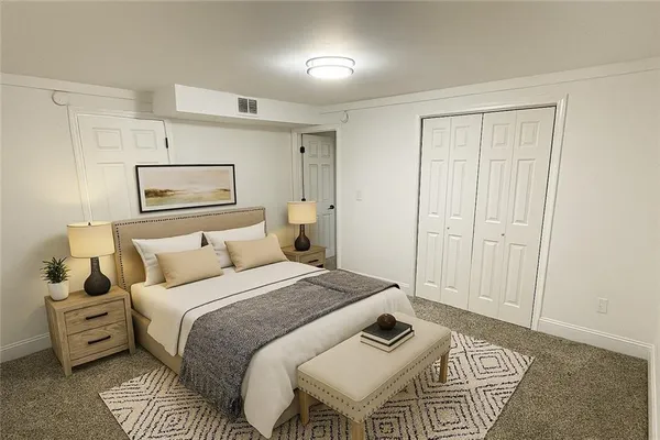 a bed room with a bed and a night stand