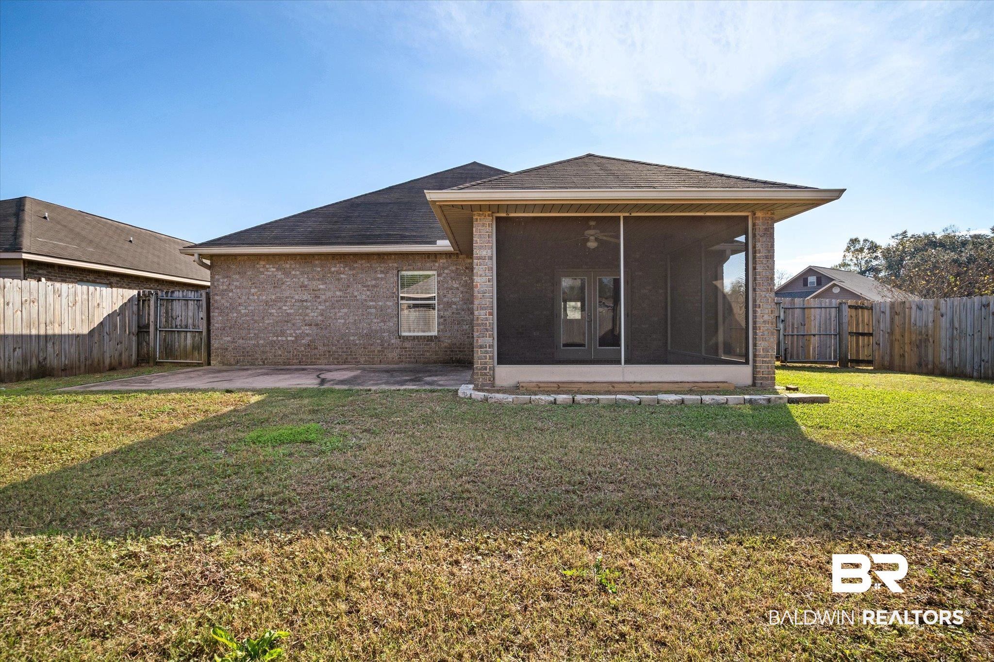 10251 Fionn Loop Daphne, AL 36526 - Photo 22 of 28 Back of property with a yard, ceiling fan, a patio area, and a sunroom