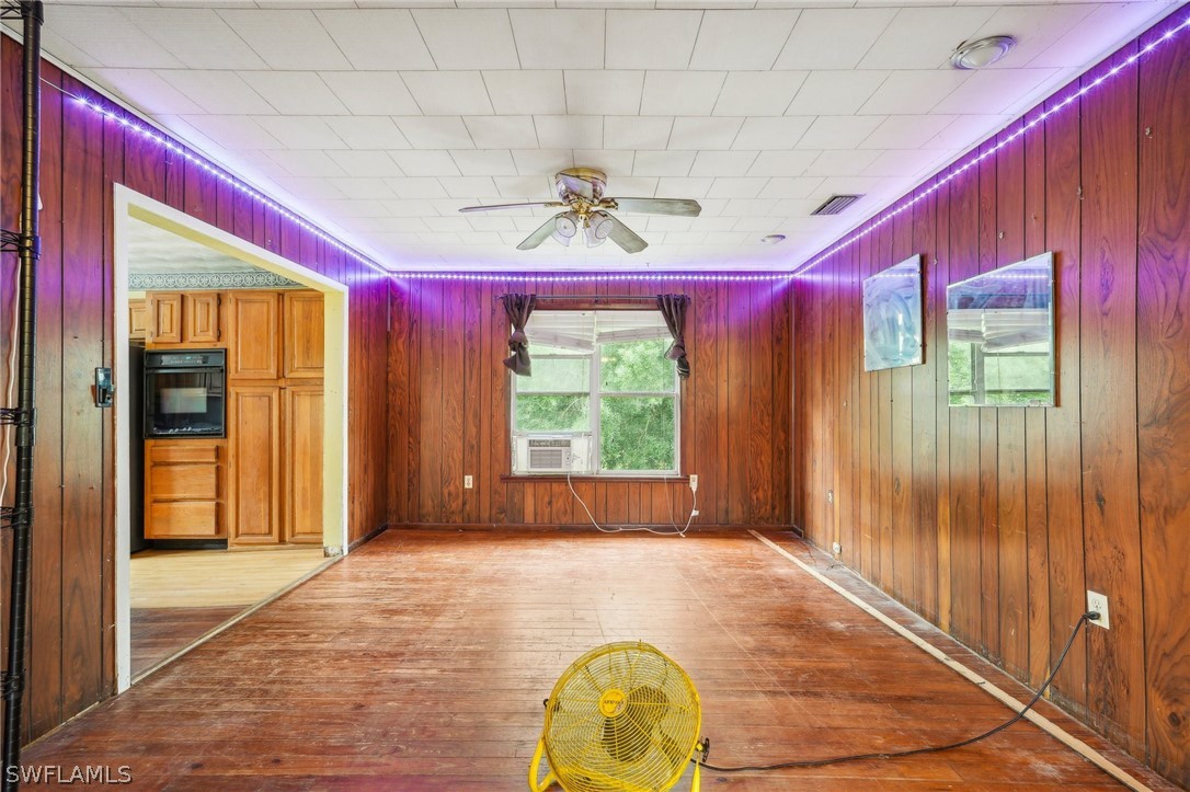 23701 North River Road Alva, FL 33920 - Photo 9 of 18 a very nice looking room with a large window and chandelier