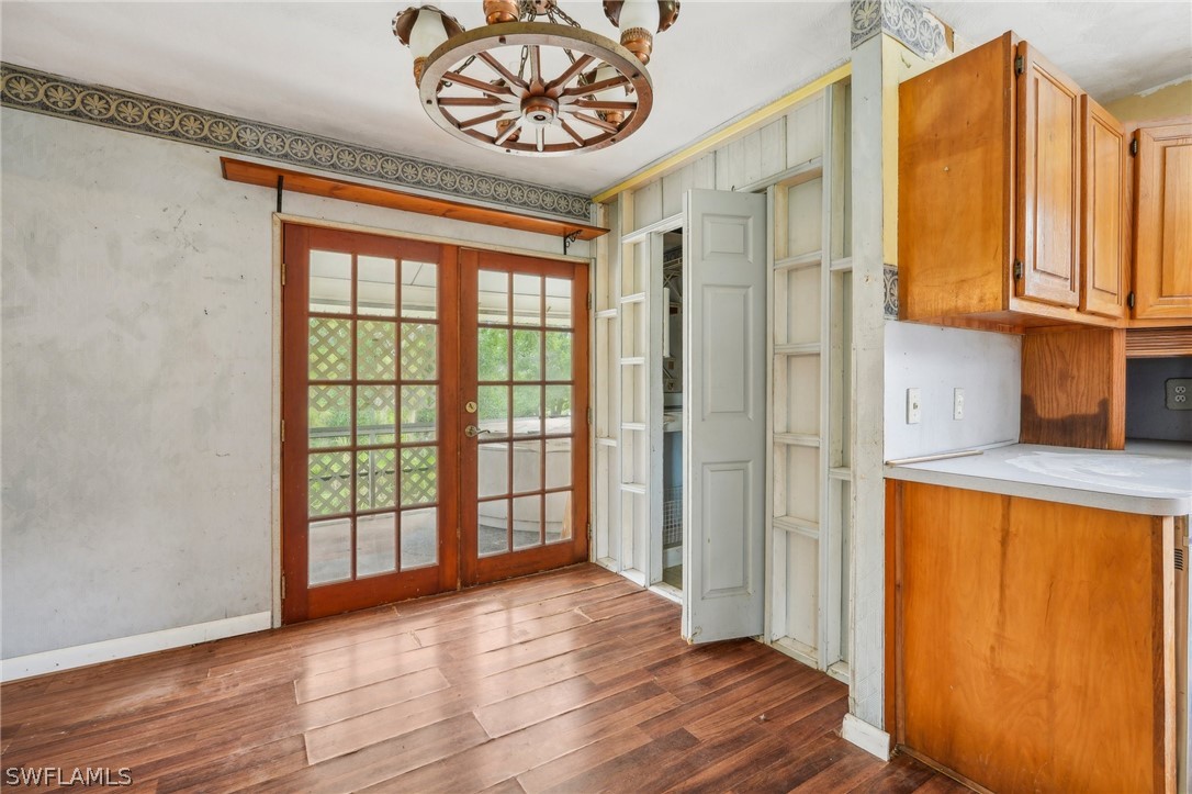 23701 North River Road Alva, FL 33920 - Photo 10 of 18 an empty room with wooden floor and windows