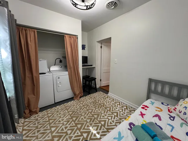 a bedroom with a bed and a dresser