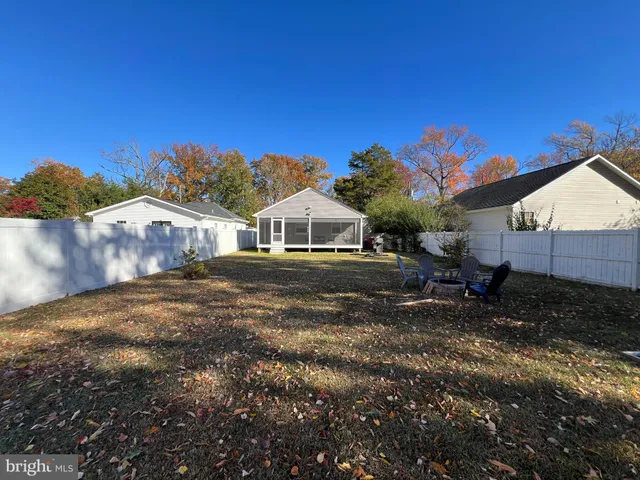 a house view with a backyard space