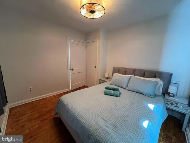 a bedroom with a bed and a lamp