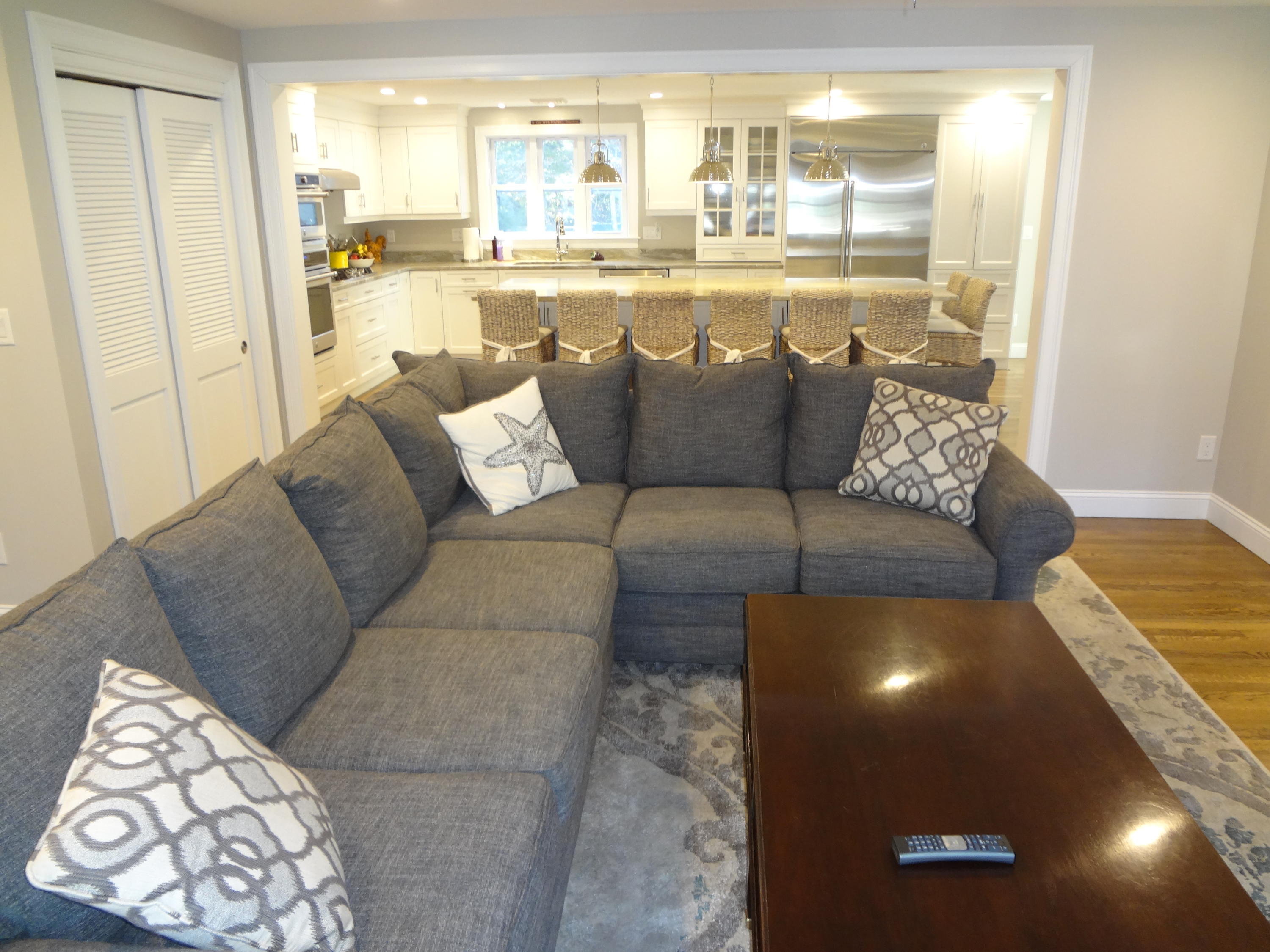 91 Ansel Howland Road Centerville, MA 02632 - Photo 11 of 30 a living room with a couch and a view of kitchen