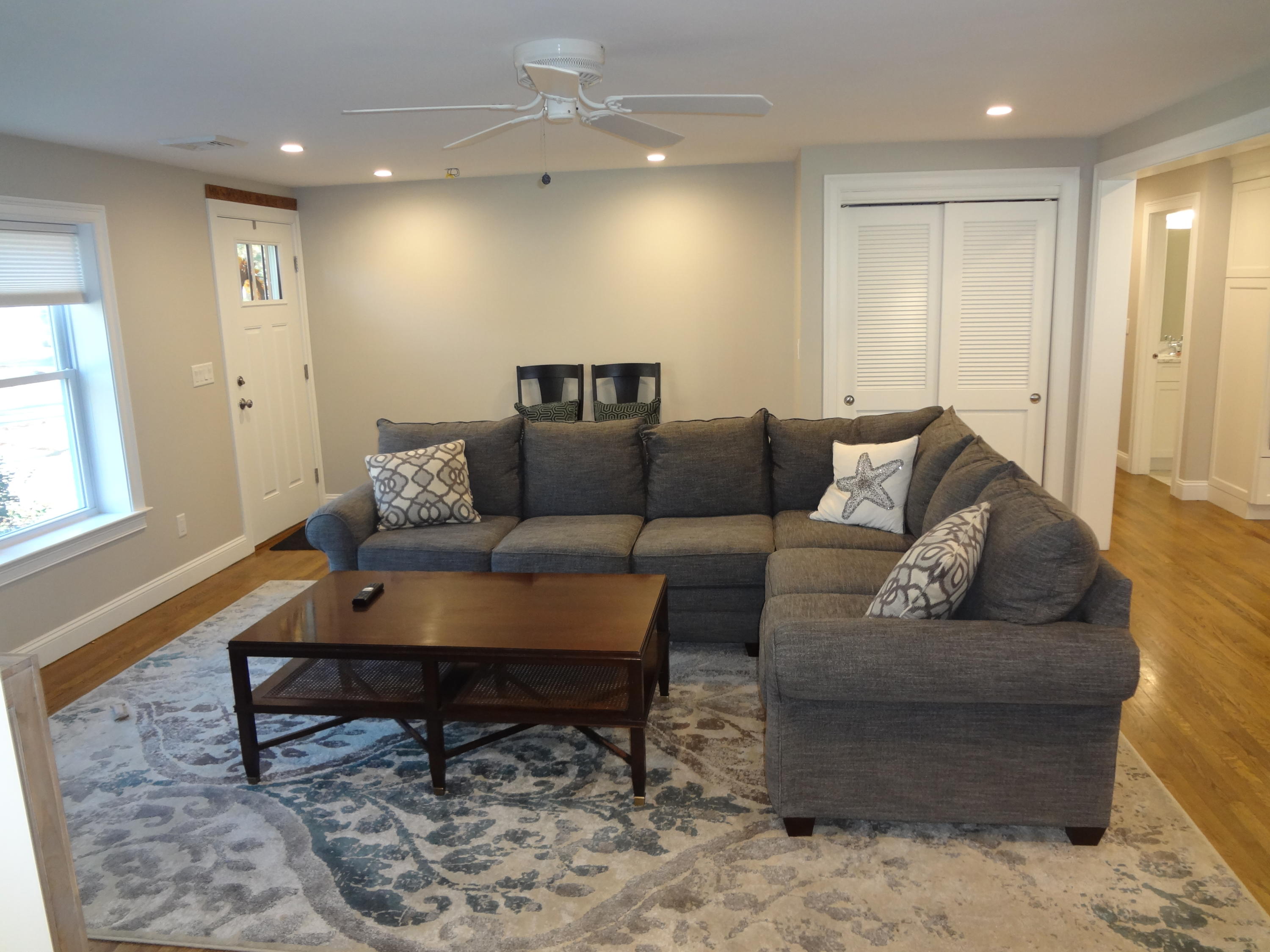 91 Ansel Howland Road Centerville, MA 02632 - Photo 12 of 30 a living room with furniture and a rug