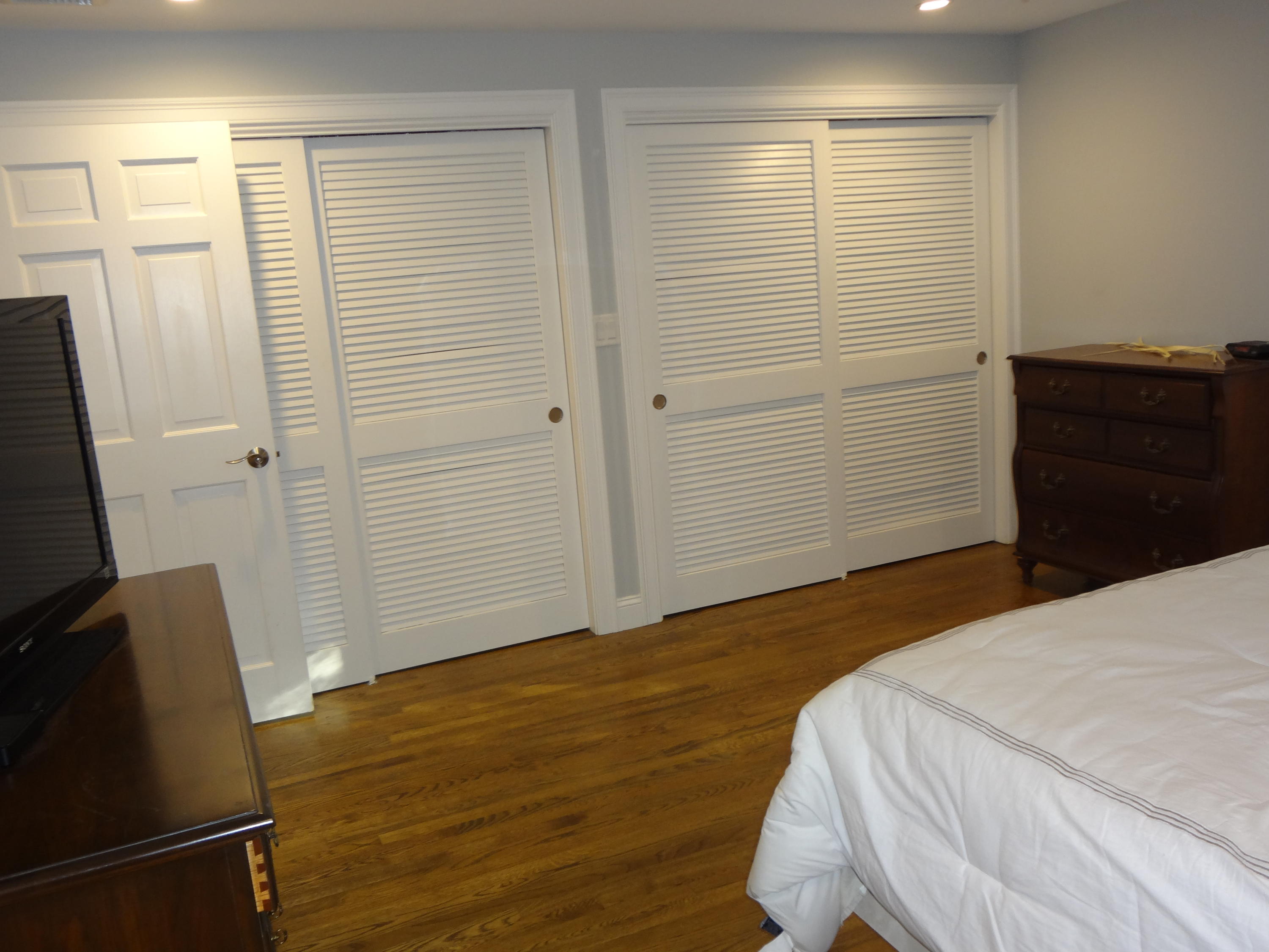 91 Ansel Howland Road Centerville, MA 02632 - Photo 17 of 30 a bedroom with a bed and wooden floor