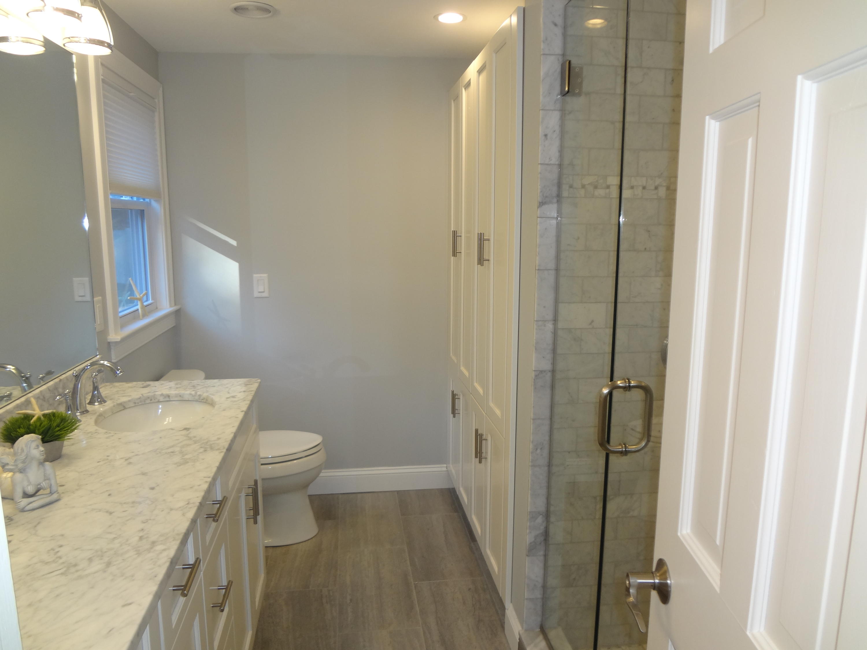 91 Ansel Howland Road Centerville, MA 02632 - Photo 19 of 30 a bathroom with a granite countertop sink a toilet and shower