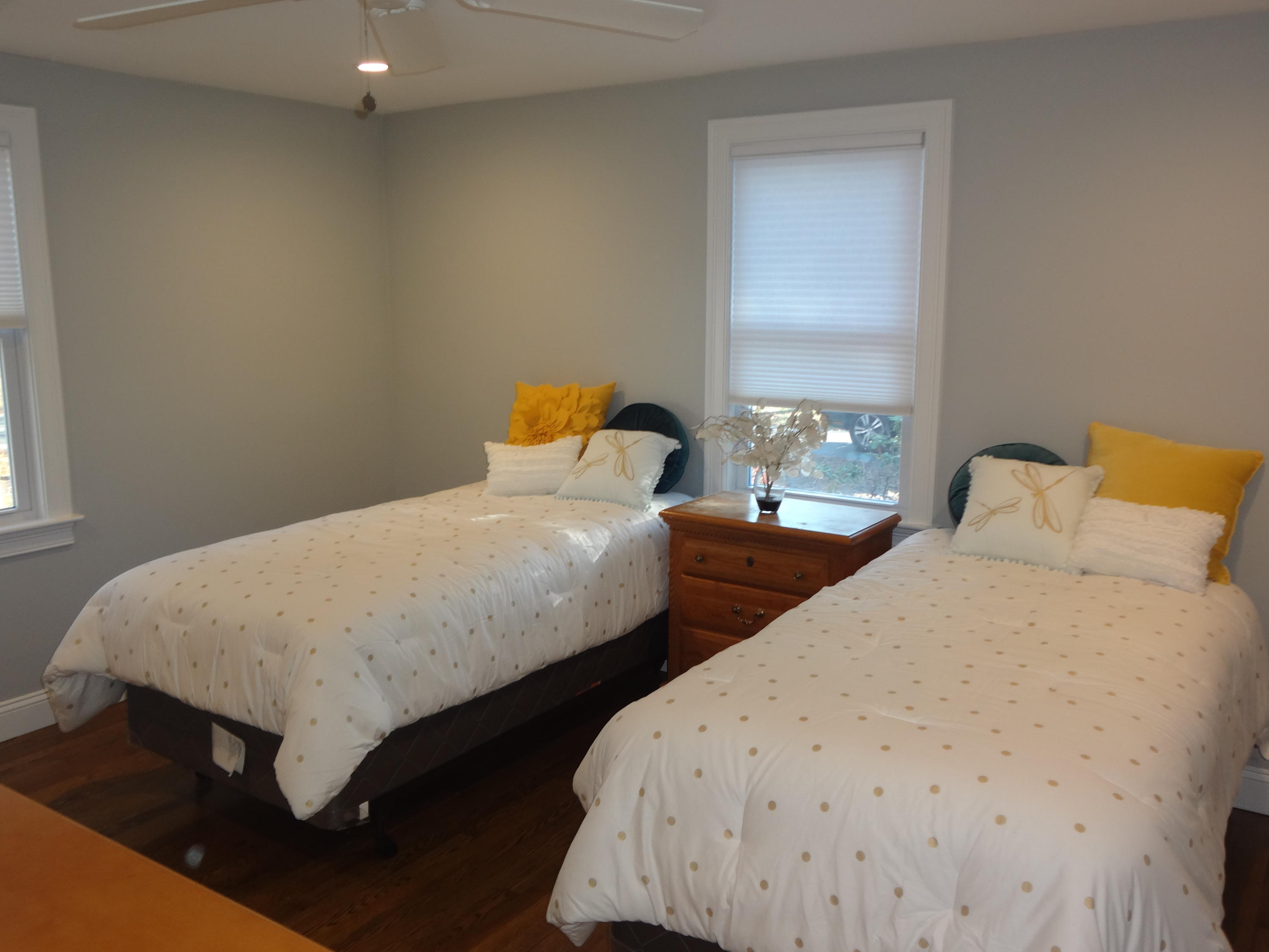 91 Ansel Howland Road Centerville, MA 02632 - Photo 21 of 30 a bedroom with two beds and a window