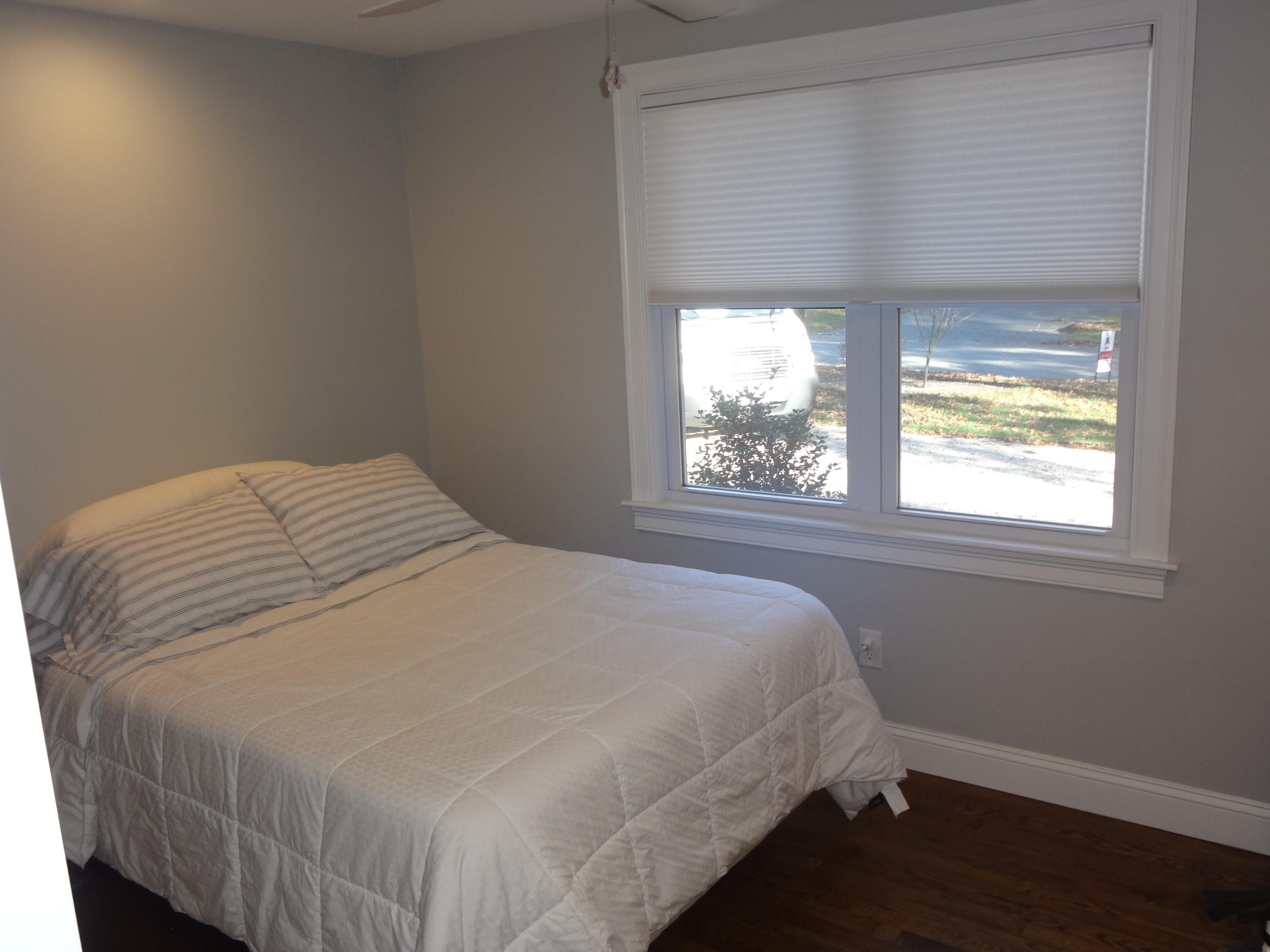 91 Ansel Howland Road Centerville, MA 02632 - Photo 22 of 30 a bedroom with a bed and a window