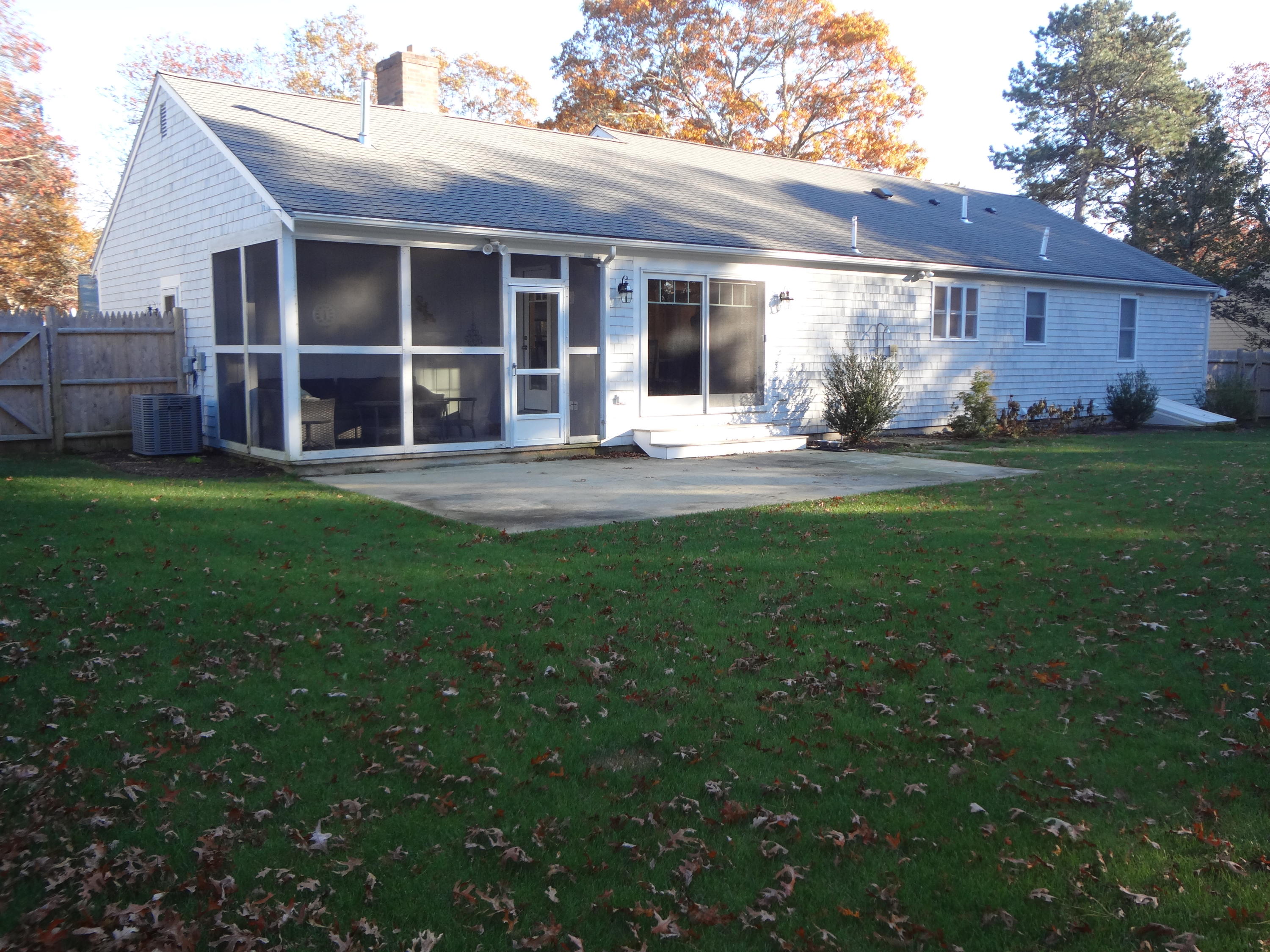 91 Ansel Howland Road Centerville, MA 02632 - Photo 3 of 30 a front view of a house with garden