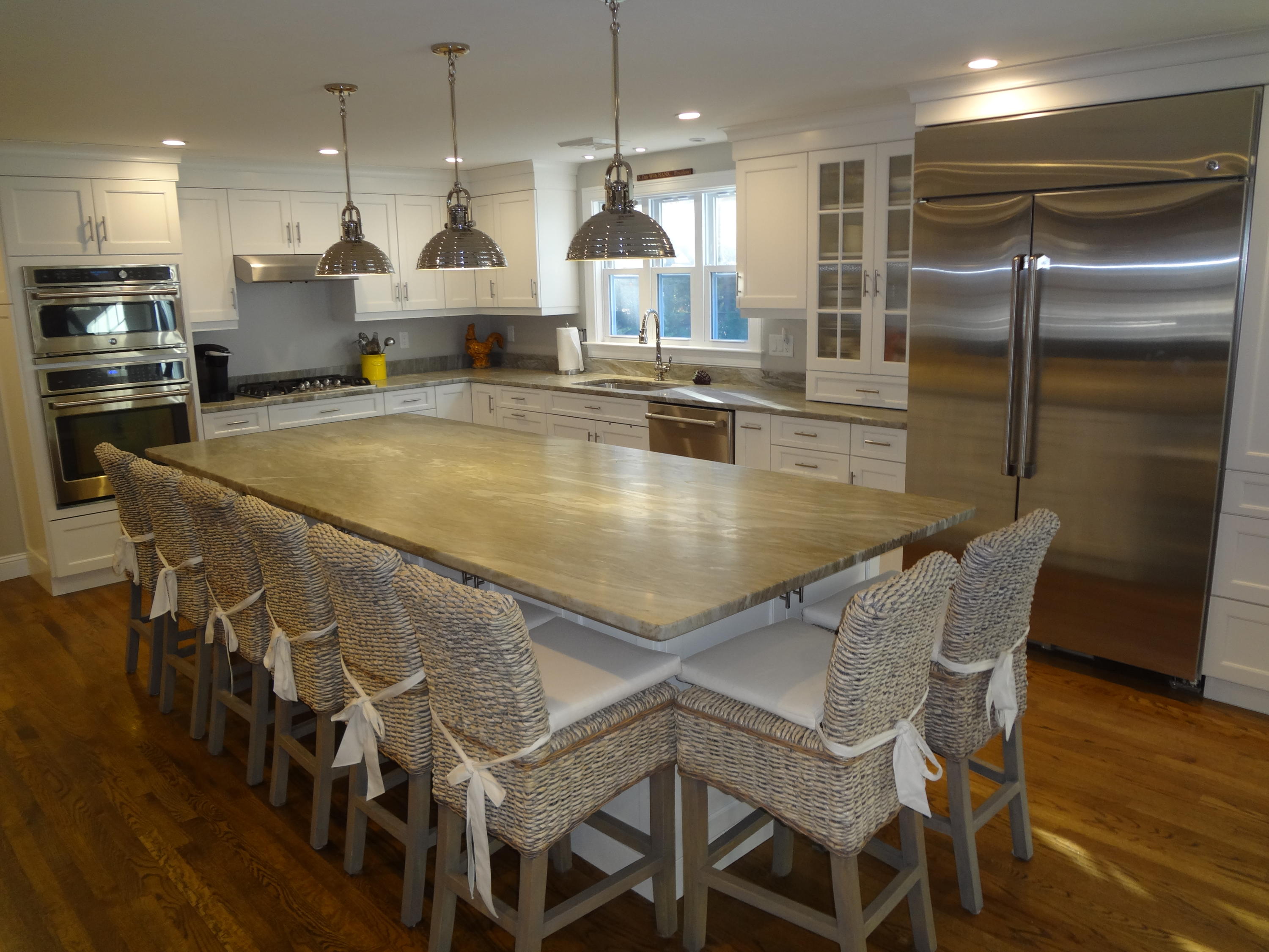 91 Ansel Howland Road Centerville, MA 02632 - Photo 4 of 30 a kitchen with stainless steel appliances granite countertop a kitchen island a stove and a sink