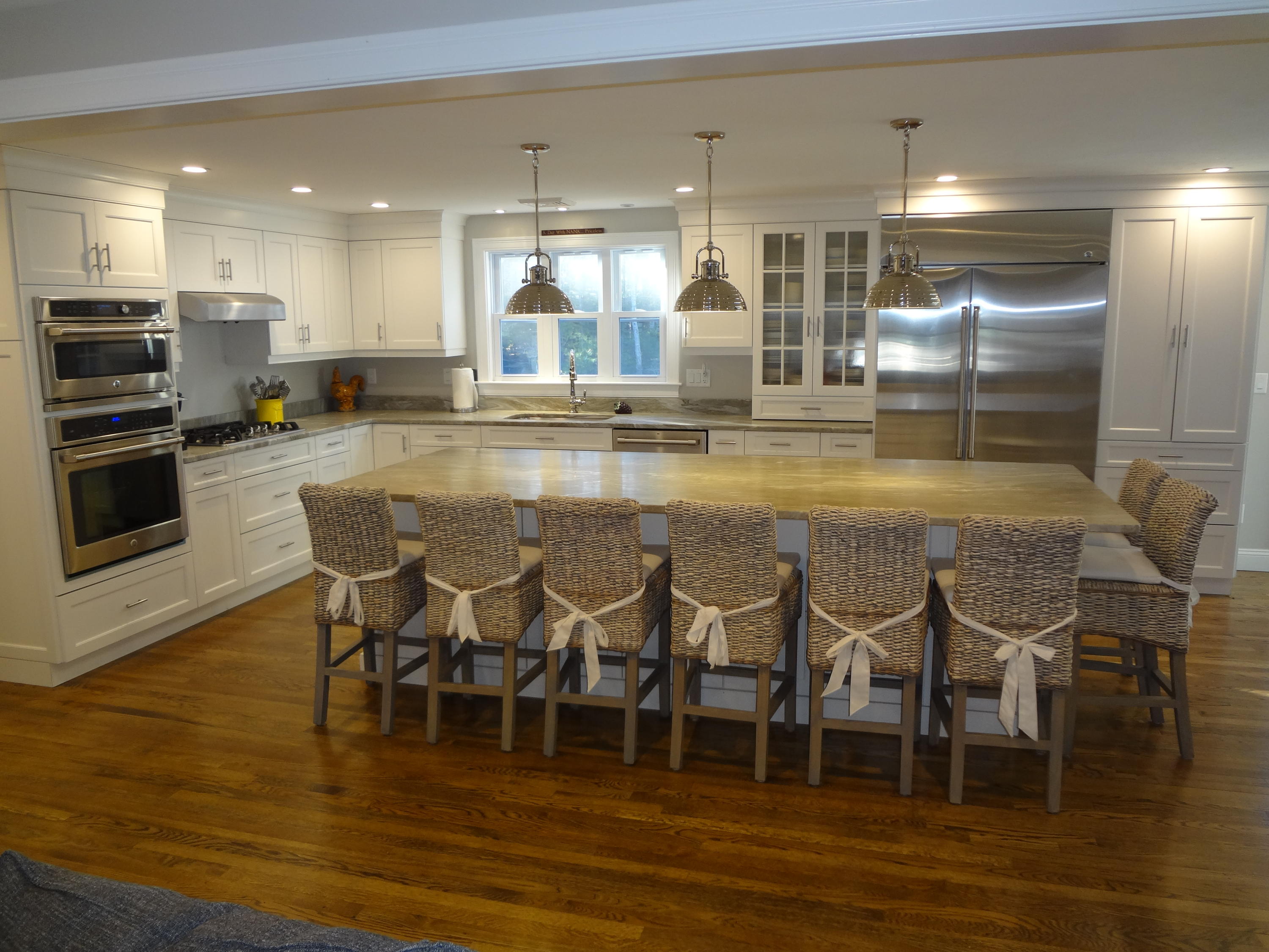 91 Ansel Howland Road Centerville, MA 02632 - Photo 5 of 30 a large kitchen with a table and chairs