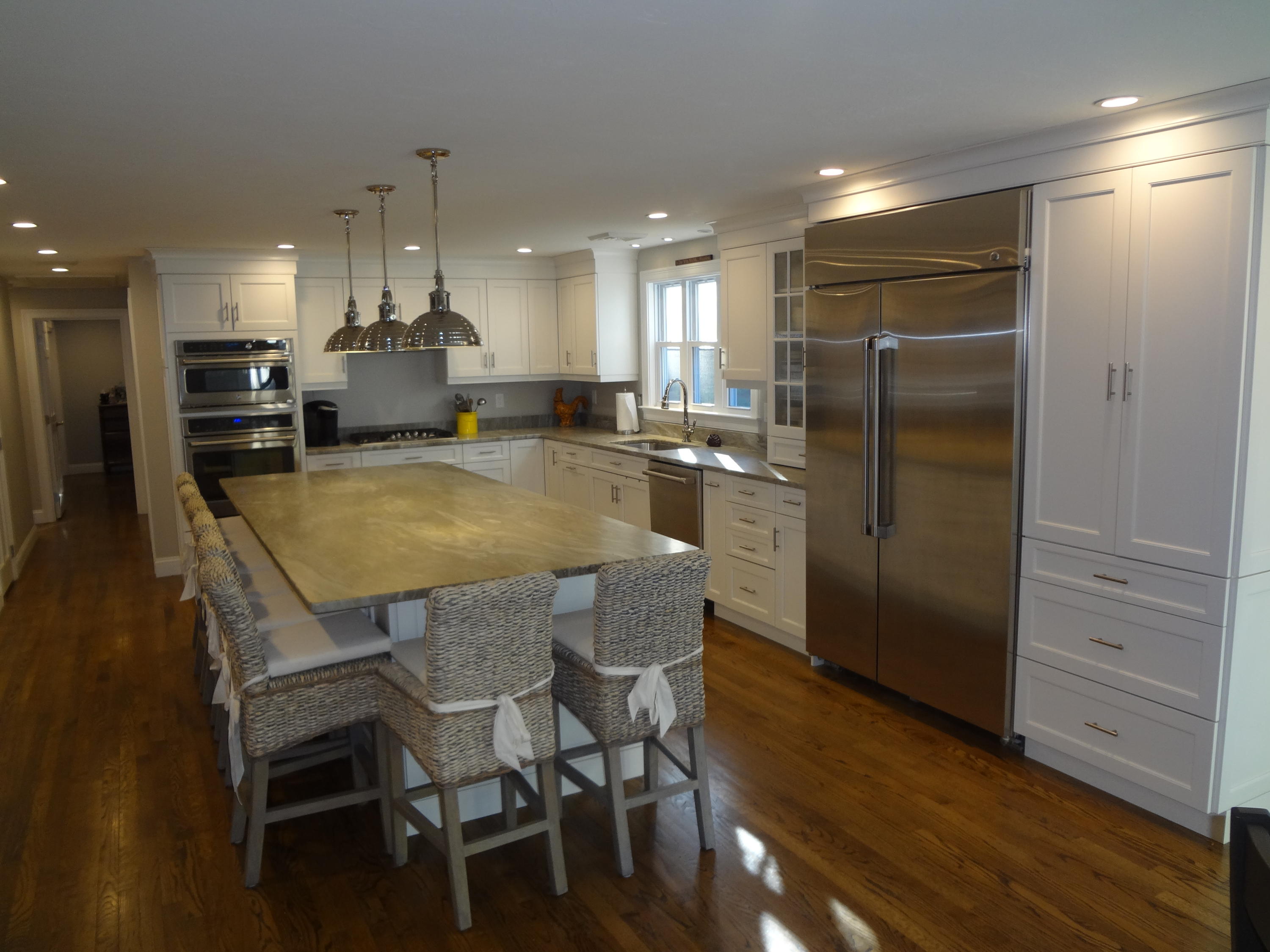 91 Ansel Howland Road Centerville, MA 02632 - Photo 7 of 30 a kitchen with a table and chairs in it