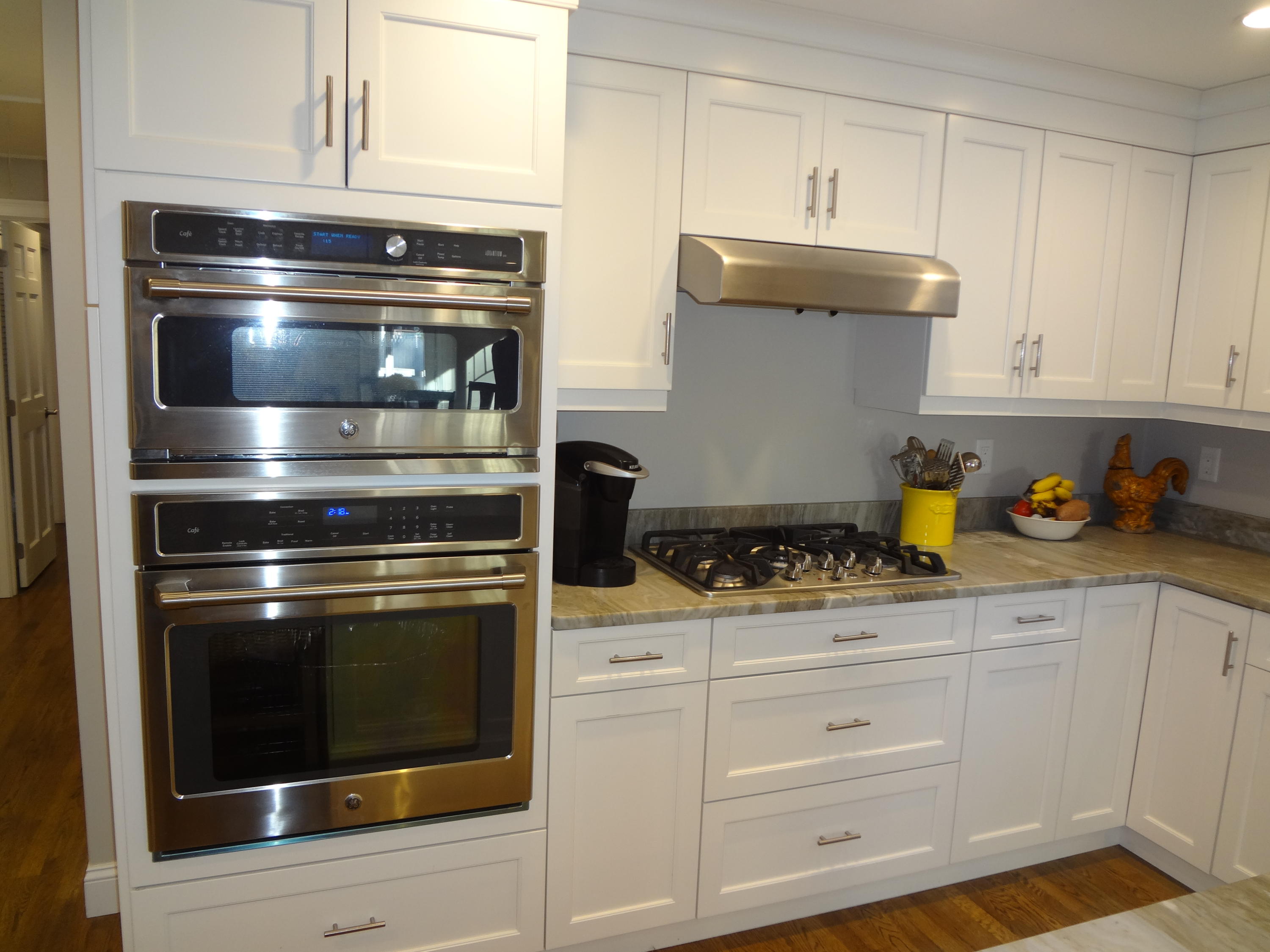 91 Ansel Howland Road Centerville, MA 02632 - Photo 9 of 30 a stove top oven sitting inside of a kitchen