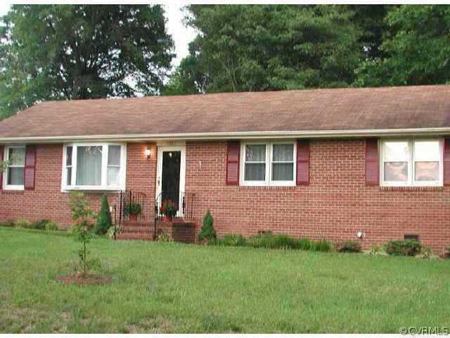5325 Chesdin Road Petersburg, VA 23803 - Photo 1 of 8 a backyard of a house with table and chairs