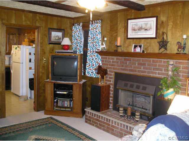 5325 Chesdin Road Petersburg, VA 23803 - Photo 2 of 8 a living room with furniture and a flat screen tv