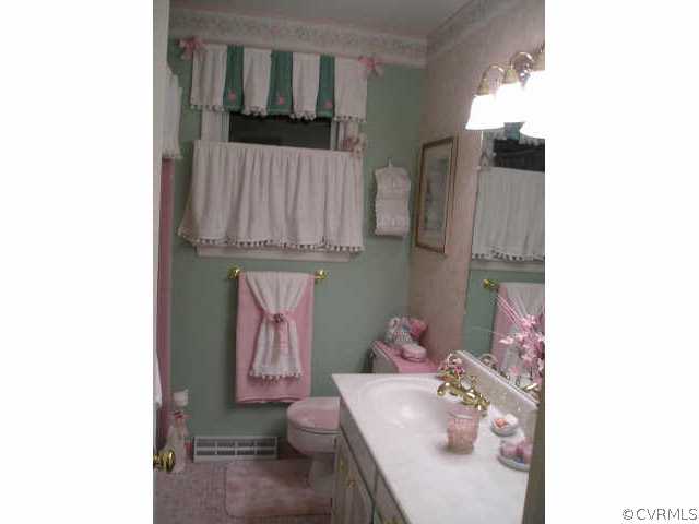 5325 Chesdin Road Petersburg, VA 23803 - Photo 5 of 8 a bathroom with a sink and a mirror