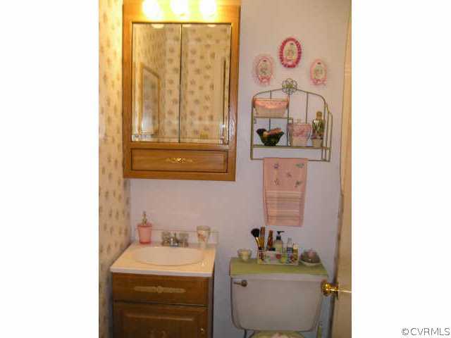 5325 Chesdin Road Petersburg, VA 23803 - Photo 6 of 8 a bathroom with a sink and a mirror