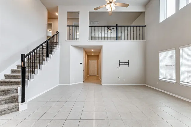 a view of an empty room with stairs