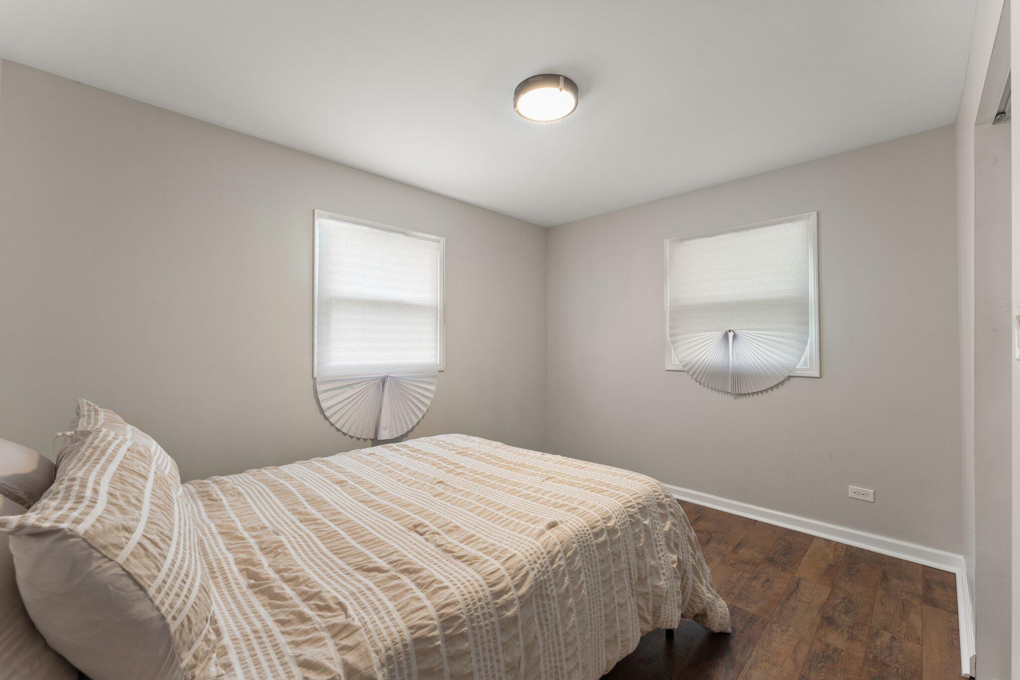 355 South Howard Street Gary, IN 46403 - Photo 11 of 16 a bedroom with a bed and a window