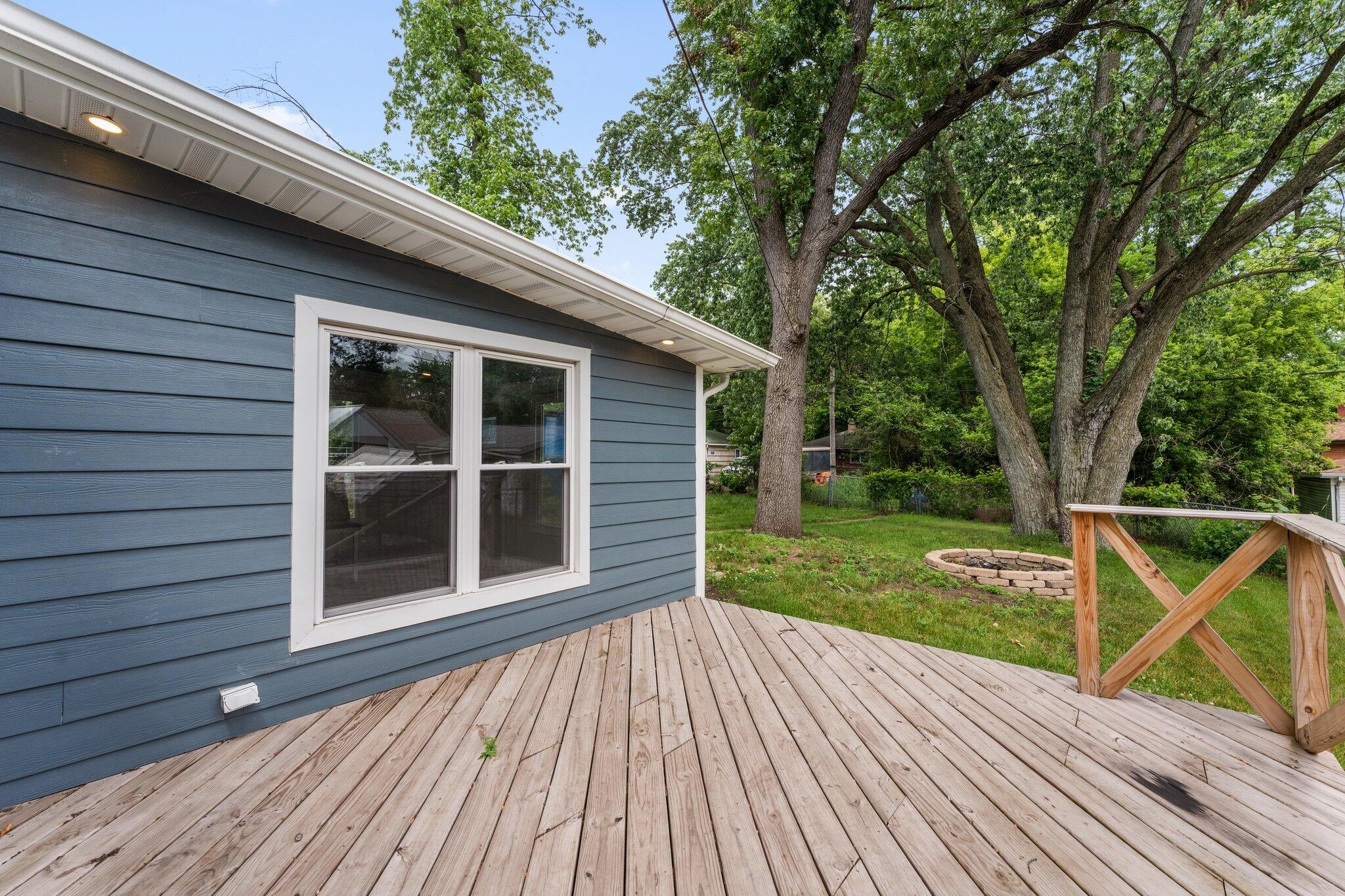 355 South Howard Street Gary, IN 46403 - Photo 13 of 16 a view of backyard with deck and garden