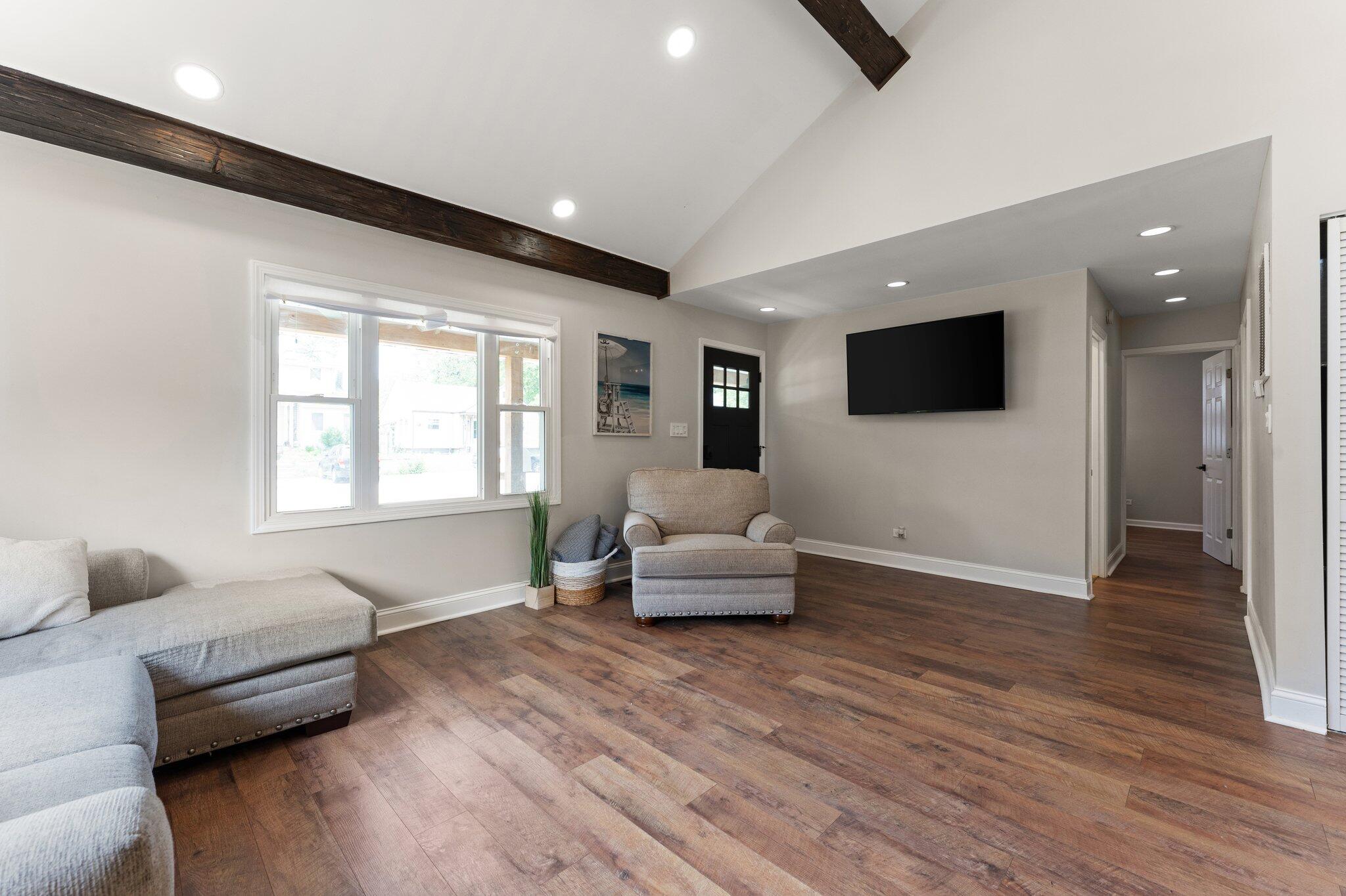 355 South Howard Street Gary, IN 46403 - Photo 6 of 16 a living room with furniture and a flat screen tv