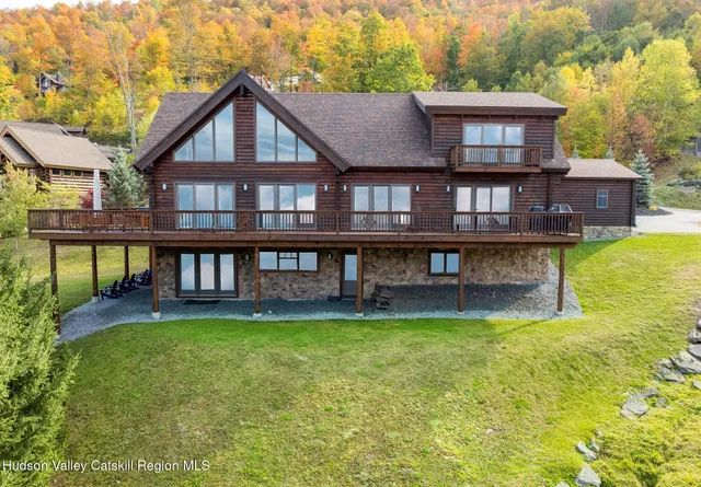 a house with swimming pool in front of it