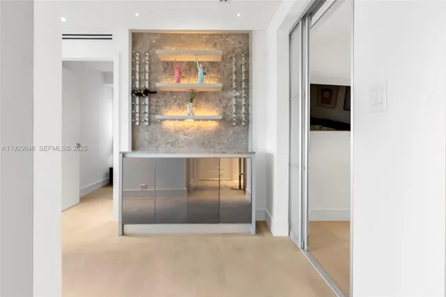 a view of a living room with a fireplace