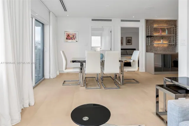 a room with lots of chairs and mirrors