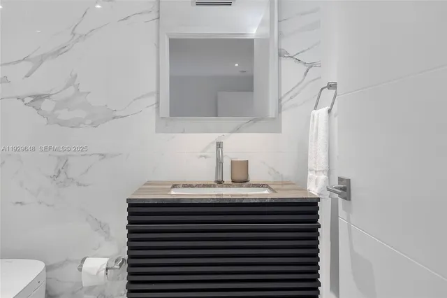 a bathroom with a sink and a toilet