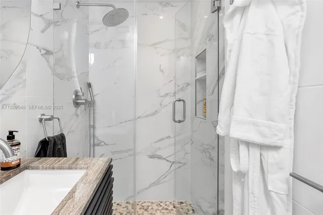 a bathroom with a sink and a shower