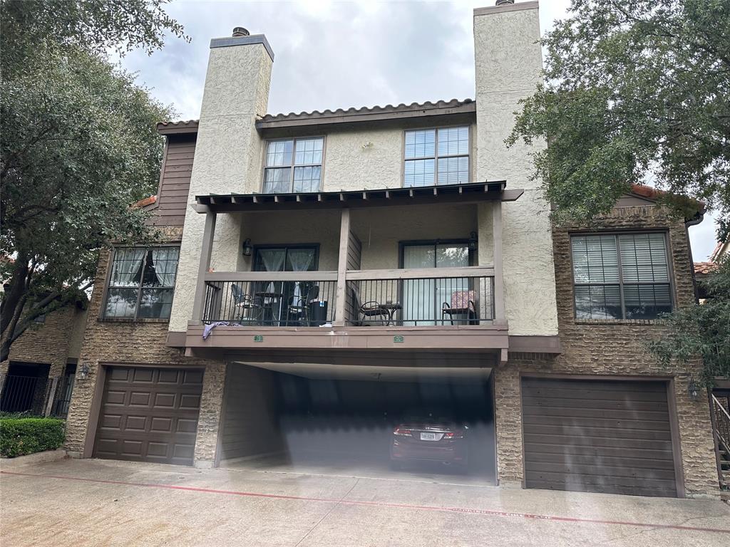 336 Melrose Drive, Unit 7B Richardson, TX 75080 - Photo 1 of 18 Rear view of property featuring an attached garage, a chimney, a balcony, and stucco siding