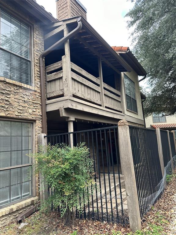 336 Melrose Drive, Unit 7B Richardson, TX 75080 - Photo 3 of 18 View of property exterior with stone siding